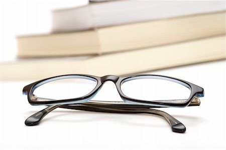 simsearch:700-00195691,k - Books and reading glasses on white background Photographie de stock - Aubaine LD & Abonnement, Code: 400-03968347
