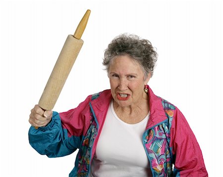 simsearch:400-07221782,k - A very angry senior lady holding a rolling pin and threatening to whack someone with it (her husband?).  Isolated on white. Stock Photo - Budget Royalty-Free & Subscription, Code: 400-03969115