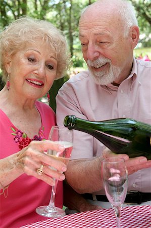 simsearch:400-04208630,k - A handsome senior husband pouring champagne for his beautiful wife. Stock Photo - Budget Royalty-Free & Subscription, Code: 400-03969127