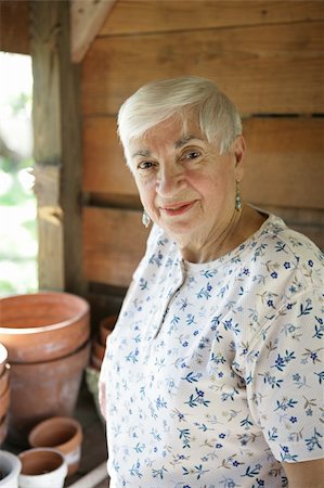 A sweet senior lady gardening in her potting shed. Stock Photo - Budget Royalty-Free & Subscription, Code: 400-03969456