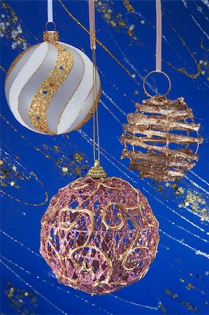 simsearch:614-02241057,k - Festive Christmas hanging balls composition on blue decorative winter background with sparkles and stars Stock Photo - Budget Royalty-Free & Subscription, Code: 400-03969981