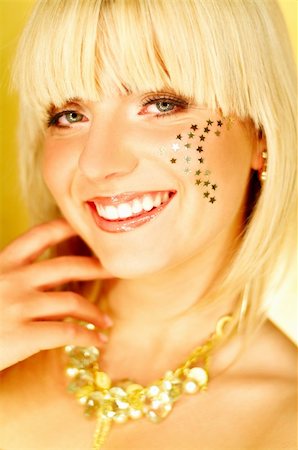 simsearch:400-04725812,k - Portrait of beautiful young smiling woman with red lipstick and golden stars on chick Stock Photo - Budget Royalty-Free & Subscription, Code: 400-03960206