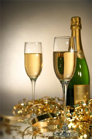 simsearch:400-05117424,k - Fluted champagne glasses with champagne bottle ready  for celebrations/ Soft focus Stock Photo - Budget Royalty-Free & Subscription, Code: 400-03961234