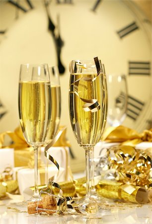 simsearch:400-05120066,k - Champagne glasses ready to bring in the New Year Photographie de stock - Aubaine LD & Abonnement, Code: 400-03961236