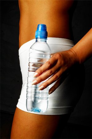 fat woman in bathing suit - Woman's body part with bottle of water Stock Photo - Budget Royalty-Free & Subscription, Code: 400-03961429