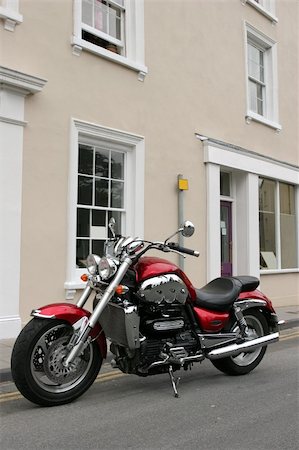 simsearch:400-03927951,k - New British motorbike in metallic red and chrome parked up on its side stand. Stock Photo - Budget Royalty-Free & Subscription, Code: 400-03961840