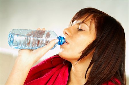 simsearch:400-03976636,k - Brunette young woman with bottle of water and red towel. After fitness Stock Photo - Budget Royalty-Free & Subscription, Code: 400-03962746