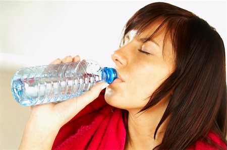 simsearch:400-03976636,k - Brunette young woman with bottle of water and red towel. After fitness Stock Photo - Budget Royalty-Free & Subscription, Code: 400-03962747