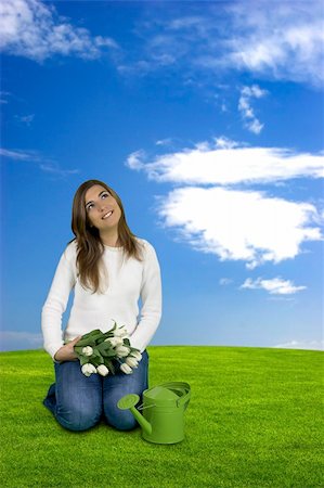 simsearch:400-03934248,k - Beautiful young woman on a green landscape with tulips Stock Photo - Budget Royalty-Free & Subscription, Code: 400-03962866