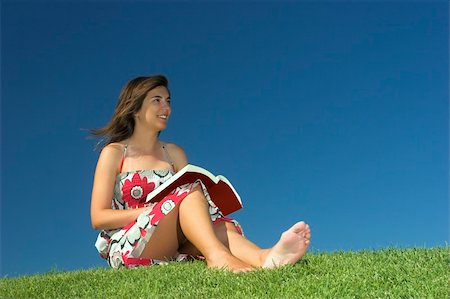 simsearch:400-03934248,k - Beautiful woman reading a book on a green meadow Stock Photo - Budget Royalty-Free & Subscription, Code: 400-03962870