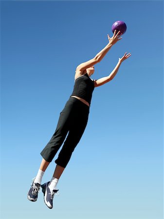 simsearch:854-03538943,k - Young woman jumping to catch the ball Stock Photo - Budget Royalty-Free & Subscription, Code: 400-03962980