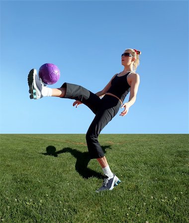 Young woman exercising with the ball in a park Stock Photo - Budget Royalty-Free & Subscription, Code: 400-03962981