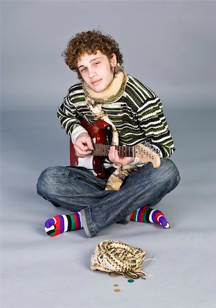 simsearch:400-04335148,k - Beatiful young man with guitar on isolated background Foto de stock - Super Valor sin royalties y Suscripción, Código: 400-03963975