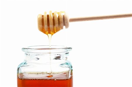 simsearch:400-05135233,k - Pouring honey on glass jar, on white background Foto de stock - Super Valor sin royalties y Suscripción, Código: 400-03975164