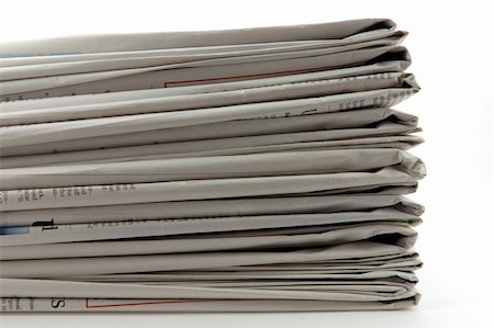 Stack of newspaper in isolated white background Stock Photo - Budget Royalty-Free & Subscription, Code: 400-03977204