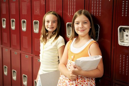 simsearch:614-06973669,k - Two adolescent school girls in front of their lockers. Stock Photo - Budget Royalty-Free & Subscription, Code: 400-03970525