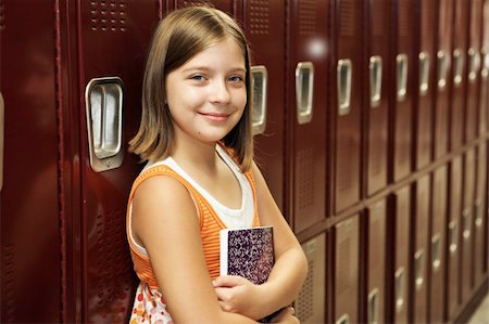 simsearch:614-06973669,k - A pretty school girl leaning against her locker. Stock Photo - Budget Royalty-Free & Subscription, Code: 400-03970520