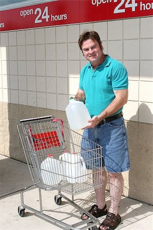 simsearch:859-06617237,k - A man with a shopping cart full of water bottles in preparation for a hurricane.  Could also be used for recycling. Stock Photo - Budget Royalty-Free & Subscription, Code: 400-03971134