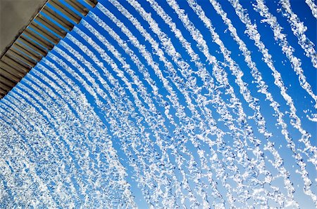simsearch:614-06813723,k - Abstract of lines of cascading water, with a blue sky background. Stock Photo - Budget Royalty-Free & Subscription, Code: 400-03971318