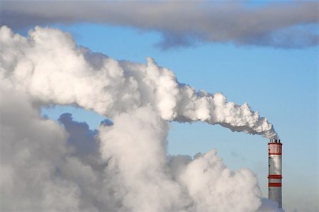 simsearch:400-07171274,k - A smoking chimney against a blue sky. Stock Photo - Budget Royalty-Free & Subscription, Code: 400-03971354