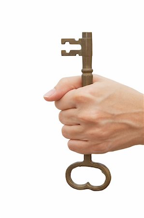 simsearch:693-06325208,k - Woman holding a skeleton key over white background - metaphor for success and having a solution Stock Photo - Budget Royalty-Free & Subscription, Code: 400-03972096