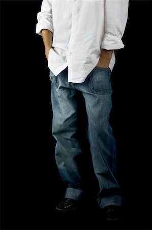 simsearch:400-04332775,k - Picture of a boy on a black background with hands on the pockets Stock Photo - Budget Royalty-Free & Subscription, Code: 400-03972116
