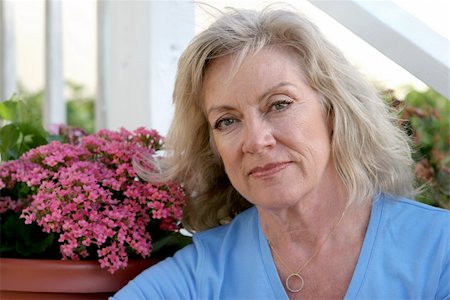 fitness grandma - A concerned looking middle aged woman sitting on her front porch. Stock Photo - Budget Royalty-Free & Subscription, Code: 400-03972227