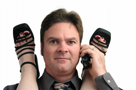 foot rings images - A man in the middle of an office affair receiving a phone call. Stock Photo - Budget Royalty-Free & Subscription, Code: 400-03972264