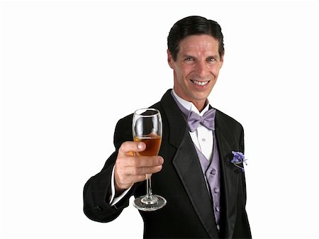 simsearch:846-05646372,k - A handsome man in a tuxedo giving a toast with champagne. Photographie de stock - Aubaine LD & Abonnement, Code: 400-03972380