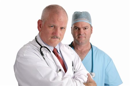 simsearch:649-07064718,k - Two medical doctors, serious and concerned.  Isolated on white. Stock Photo - Budget Royalty-Free & Subscription, Code: 400-03972479