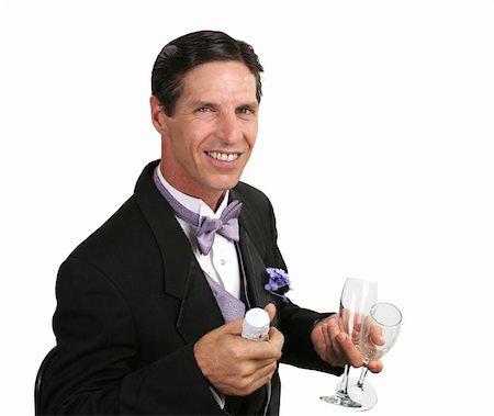 simsearch:846-05646372,k - Un bel homme dans un smoking avec une bouteille de champagne et deux verres. Photographie de stock - Aubaine LD & Abonnement, Code: 400-03972472