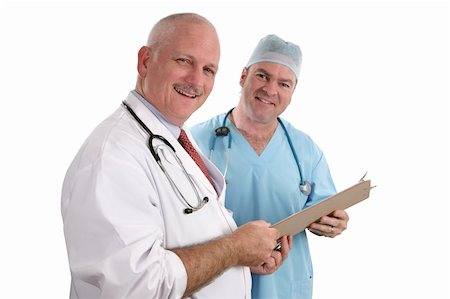 simsearch:649-07064718,k - A horizontal view of two handsome, smiling doctors holding a patient's chart.  Isolated. (focus on doctor in foreground) Stock Photo - Budget Royalty-Free & Subscription, Code: 400-03972482