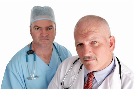 simsearch:649-07064718,k - Two doctors looking worried, isolated on white. Stock Photo - Budget Royalty-Free & Subscription, Code: 400-03972493