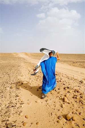 desert people dress photos - A woman walking through the desert. Stock Photo - Budget Royalty-Free & Subscription, Code: 400-03973023