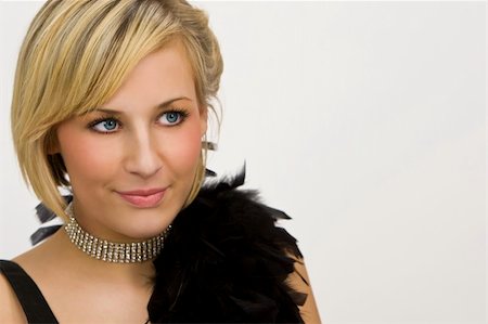 feather boa - Studio shot of a beautiful young blond woman dressed in evening wear complete with a diamond choker Photographie de stock - Aubaine LD & Abonnement, Code: 400-03984390