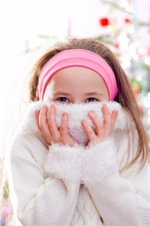 simsearch:400-07509444,k - Sweet little girl in white pullover, covering her face Stock Photo - Budget Royalty-Free & Subscription, Code: 400-03984833