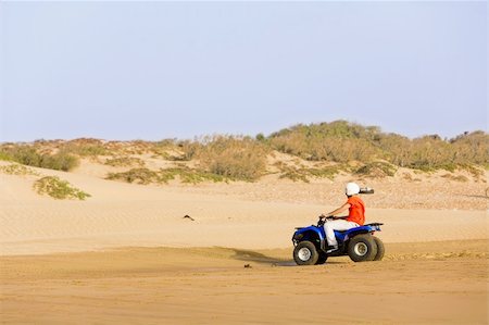 dune driving - desert race red four wheel  buggy in sand dunes Stock Photo - Budget Royalty-Free & Subscription, Code: 400-03986178