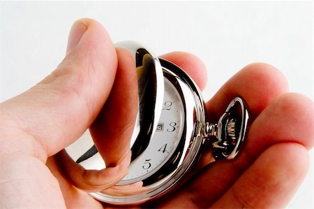 A male hand holding a fancy pocket watch Stock Photo - Budget Royalty-Free & Subscription, Code: 400-03986764