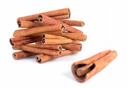 simsearch:628-02228100,k - A house made from cinnamon sticks and a single stick nearby with focus on the house shot on a white background Stock Photo - Budget Royalty-Free & Subscription, Code: 400-03986801