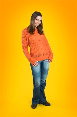 simsearch:400-04345762,k - Beautiful woman with a frendly face on a orange background Stock Photo - Budget Royalty-Free & Subscription, Code: 400-03987665