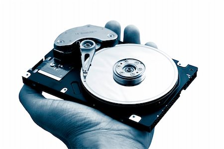 simsearch:400-05252692,k - Hand with a open hard disk drive Stock Photo - Budget Royalty-Free & Subscription, Code: 400-03989636