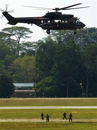 Rappeling from a transport helicopter, Singapore Photographie de stock - Aubaine LD & Abonnement, Code: 400-03983529