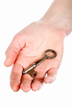 A concept image of a womans hand holding a key on an open palm. Isolated on white with clipping mask. Foto de stock - Super Valor sin royalties y Suscripción, Código: 400-03983609