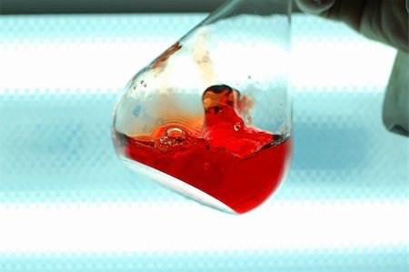 simsearch:400-09011632,k - hand shaking a chemical flask with red liqid Stock Photo - Budget Royalty-Free & Subscription, Code: 400-03994569