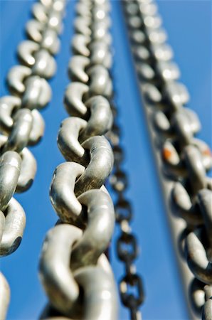 Group of chains against a blue sky Stock Photo - Budget Royalty-Free & Subscription, Code: 400-03994862