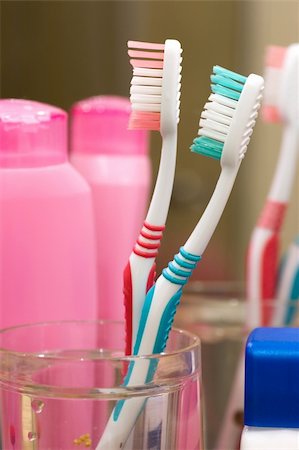 simsearch:400-04151135,k - Two different toothbrushes in glass at the bathroom Stock Photo - Budget Royalty-Free & Subscription, Code: 400-03995122