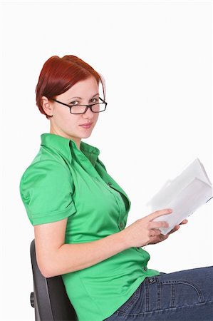 simsearch:400-04345762,k - Close-up image of a young redheaded teenager with a book in her hands. Stock Photo - Budget Royalty-Free & Subscription, Code: 400-03995424
