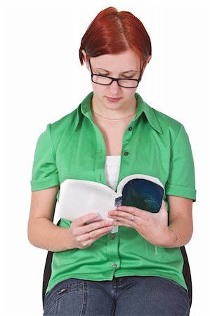 simsearch:400-04345762,k - Portrait of a redheaded girl with glasses reading a book.Shot with Canon 70-200mm f/2.8L IS USM Stock Photo - Budget Royalty-Free & Subscription, Code: 400-03995425