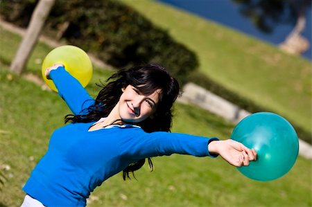Beautiful teen handling balloons Stock Photo - Budget Royalty-Free & Subscription, Code: 400-03996855
