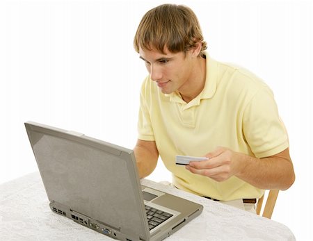 simsearch:400-04505681,k - Young college age man addicted to internet shopping.  Isolated on white. Stock Photo - Budget Royalty-Free & Subscription, Code: 400-03997987